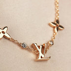 „Dream“-Armband mit Stern-, Sonnen- und 7 Motiven in Gold