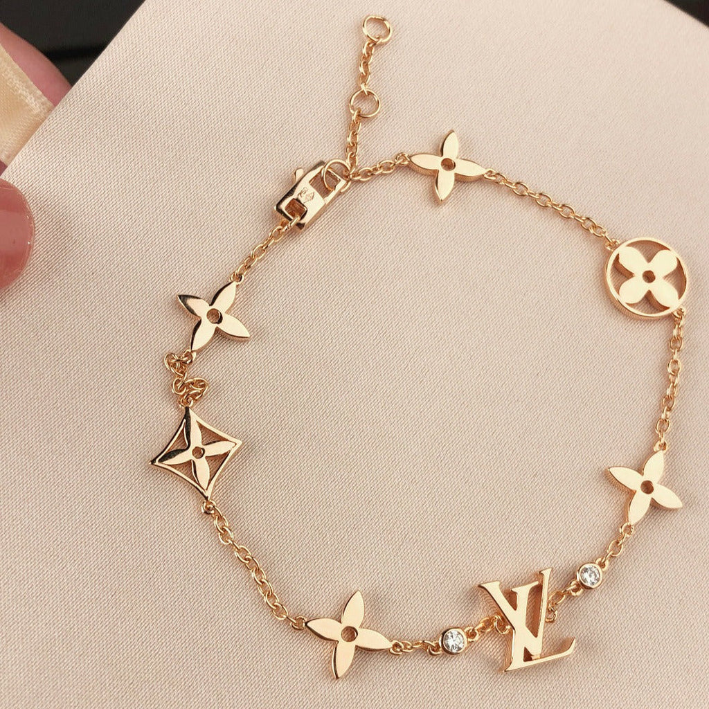 „Dream“-Armband mit Stern-, Sonnen- und 7 Motiven in Gold