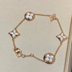 Armband mit 5 Motiven aus Perlmutt, Gold und Sterlingsilber, besetzt mit rosa Zirkonia im Traumstern- und Sonnen-Design