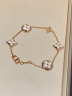 Armband mit 5 Motiven aus Perlmutt, Gold und Sterlingsilber, besetzt mit rosa Zirkonia im Traumstern- und Sonnen-Design