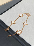 Armband mit 5 Motiven aus Perlmutt, Gold und Sterlingsilber, besetzt mit rosa Zirkonia im Traumstern- und Sonnen-Design