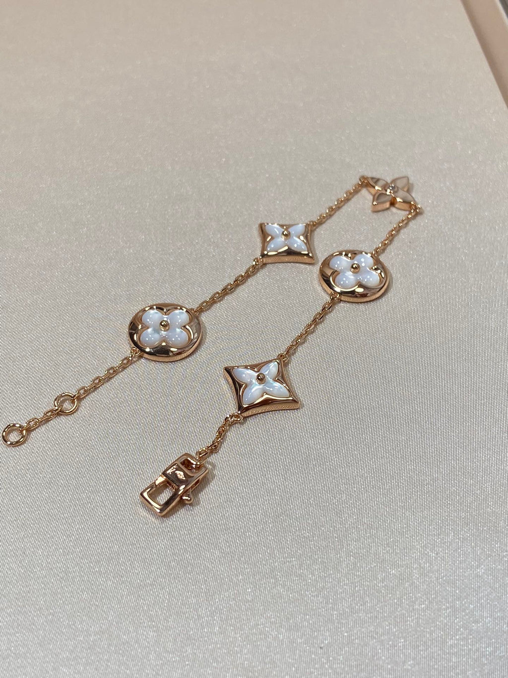 Armband mit 5 Motiven aus Perlmutt, Gold und Sterlingsilber, besetzt mit rosa Zirkonia im Traumstern- und Sonnen-Design