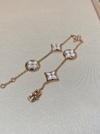 Armband mit 5 Motiven aus Perlmutt, Gold und Sterlingsilber, besetzt mit rosa Zirkonia im Traumstern- und Sonnen-Design