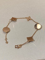 Armband mit 5 Motiven aus Perlmutt, Gold und Sterlingsilber, besetzt mit rosa Zirkonia im Traumstern- und Sonnen-Design