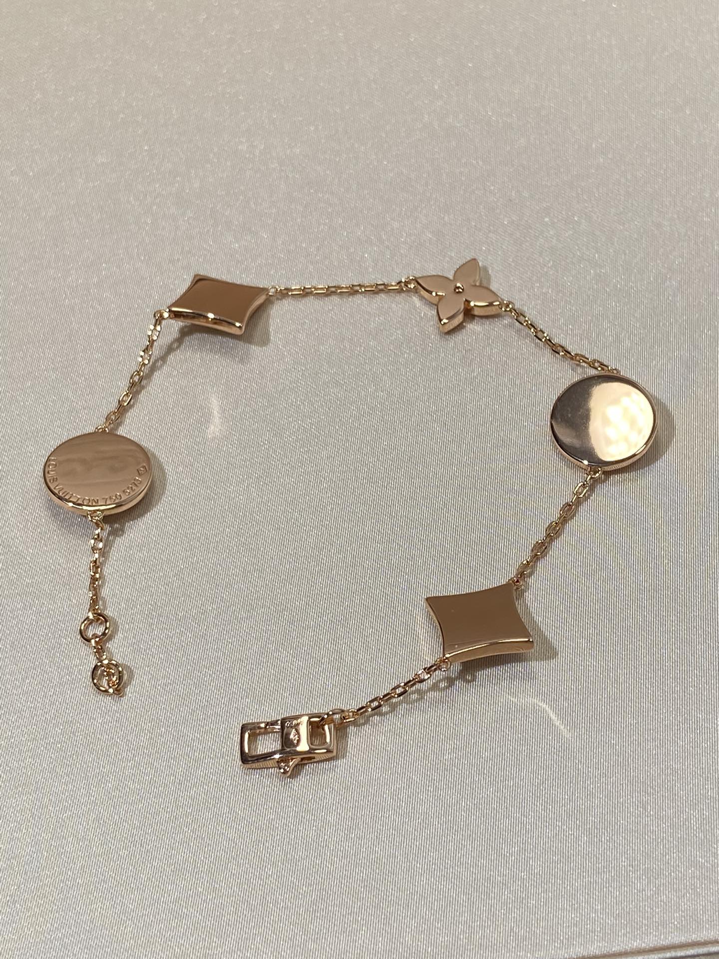 Armband mit 5 Motiven aus Perlmutt, Gold und Sterlingsilber, besetzt mit rosa Zirkonia im Traumstern- und Sonnen-Design