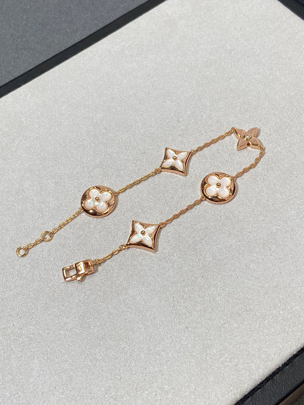 Armband mit 5 Motiven aus Perlmutt, Gold und Sterlingsilber, besetzt mit rosa Zirkonia im Traumstern- und Sonnen-Design