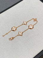 Armband mit 5 Motiven aus Perlmutt, Gold und Sterlingsilber, besetzt mit rosa Zirkonia im Traumstern- und Sonnen-Design